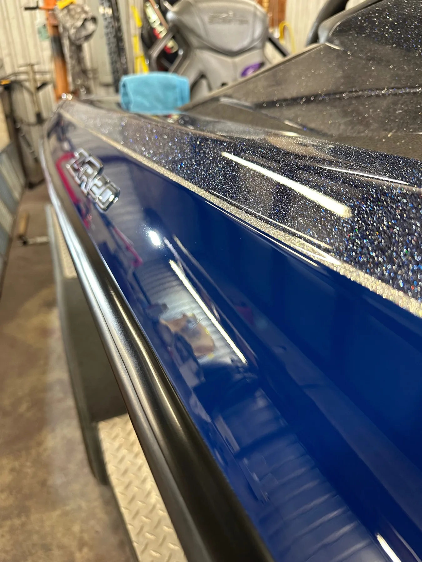 Blue bass boat with deep gloss after gelcoat correction