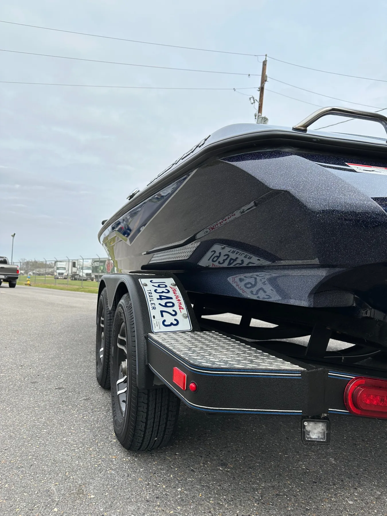 Black marine hull with deep restored reflection
