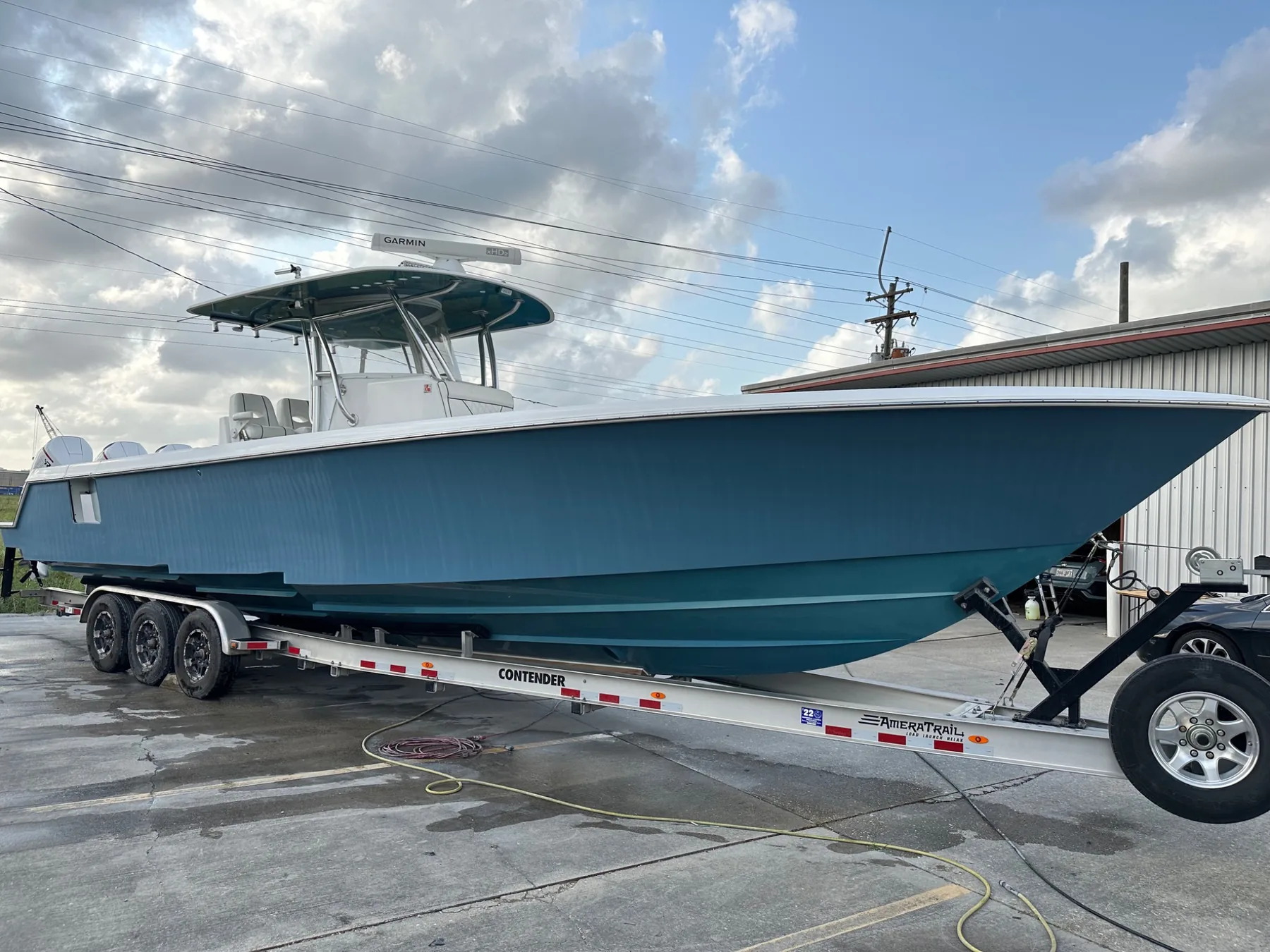 Teal center-console boat after gelcoat restoration at Down South in Youngsville
